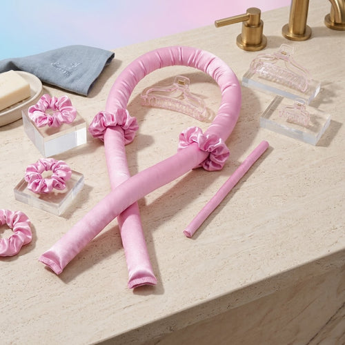 Hair wrapped around a satin heatless curling rod for overnight curls