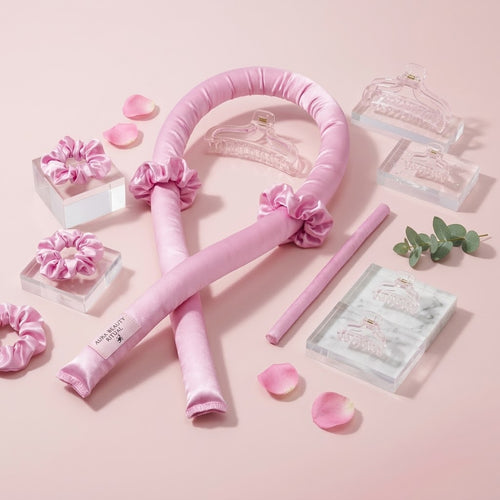 Rosé satin heatless hair curling rod from Frost Glow